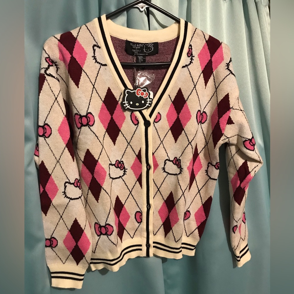 Cream Hello kitty button cardigan. Size kids 13/14.